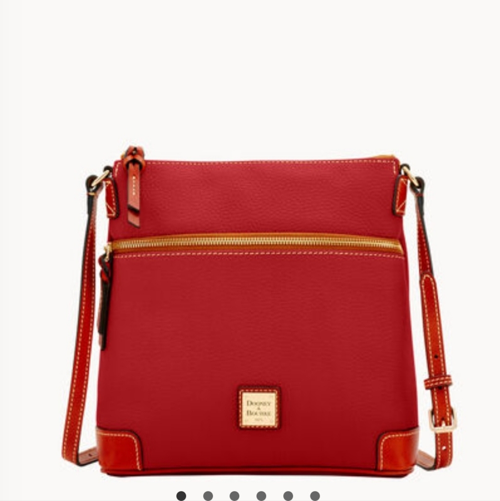 Dooney & Bourke crossbody Wine color. New in plastic